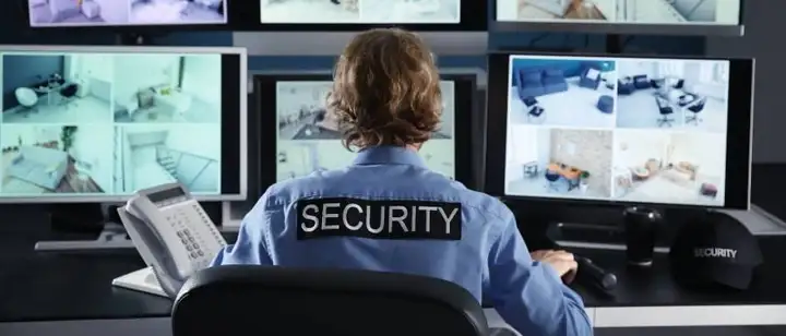 security guard looking at computer screens