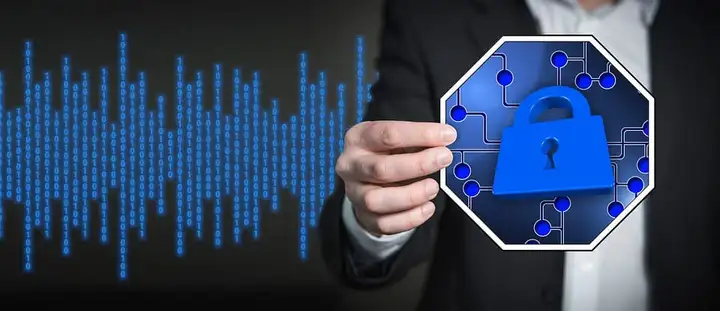 Hand in a suit holding a blue padlock icon against a background of binary digits
