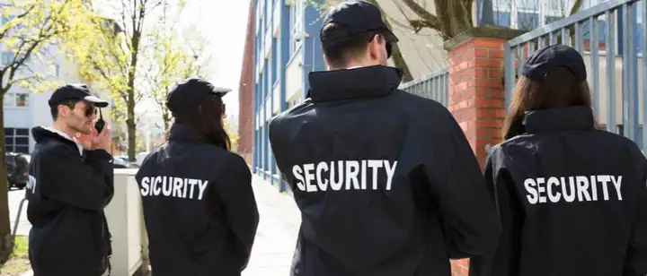 four security guards on patrol